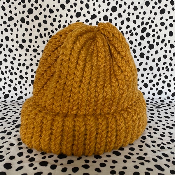Hand knitted mustard beanie hat.