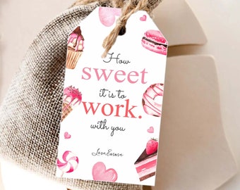 May include: A white gift tag with pink and red watercolor illustrations of sweets and the text "How sweet it is to work with you."  The tag is tied to a small burlap bag.