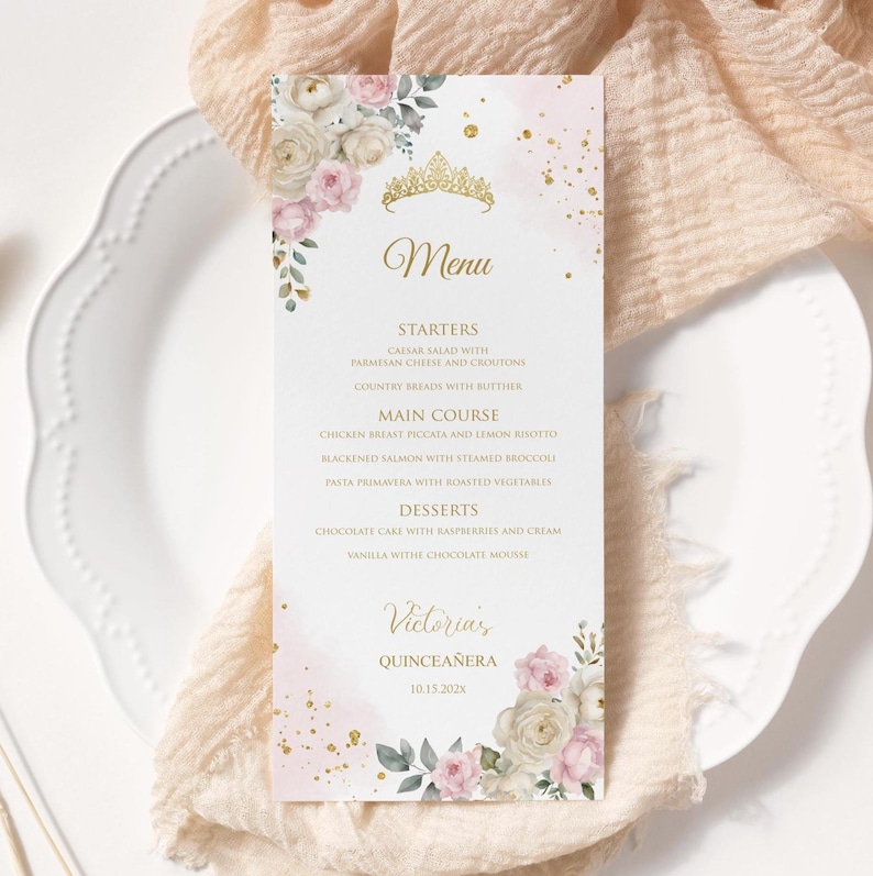 May include: A menu card with a floral design and gold accents. The menu includes starters, main courses, and desserts. The card is decorated with a gold tiara and the name "Victoria's Quincea&ntilde;era" with the date 10.15.202x.