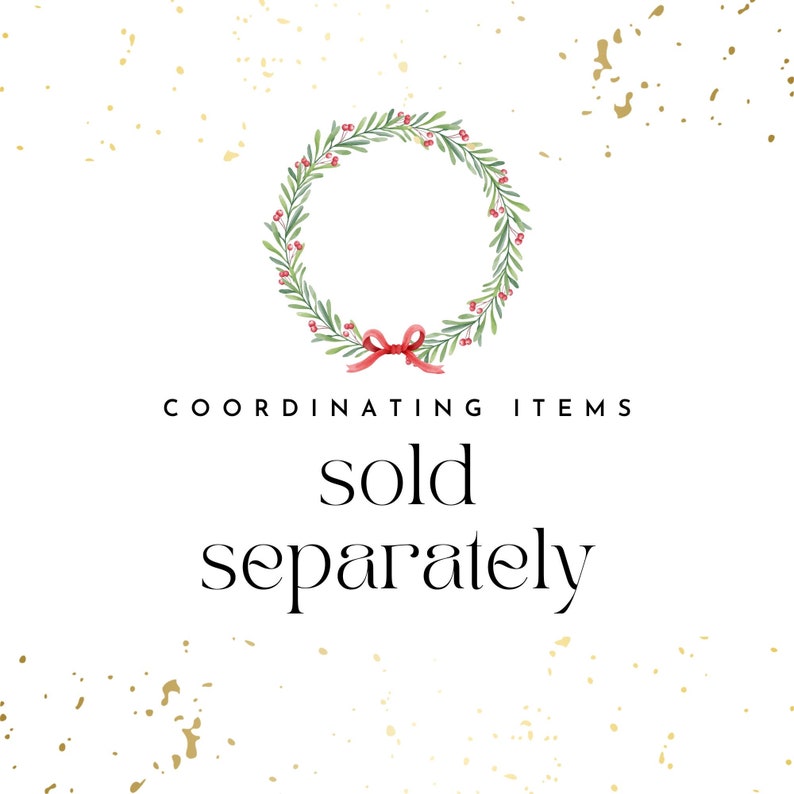 May include: A green wreath with red berries and a red bow. The text "COORDINATING ITEMS sold separately" is below the wreath.