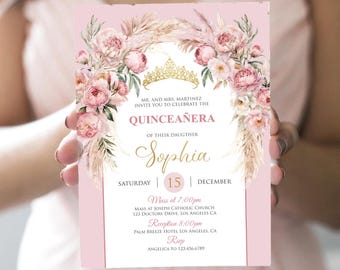 May include: Pink and gold Quinceañera invitation with a floral wreath, a crown, and the name Sophia. The invitation includes the date, time, and location of the event.  RSVP information is also included.