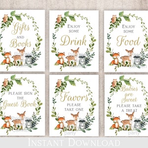 May include: Six printable signs for a baby shower with a woodland theme. The signs feature a wreath of green leaves and branches with a fox, deer, and raccoon. The signs say "Gifts and Books", "Enjoy Some Drink", "Enjoy Some Food", "Please Sign the Guest Book", "Favors Please Take One", and "Babies are Sweet Please Take a Treat".