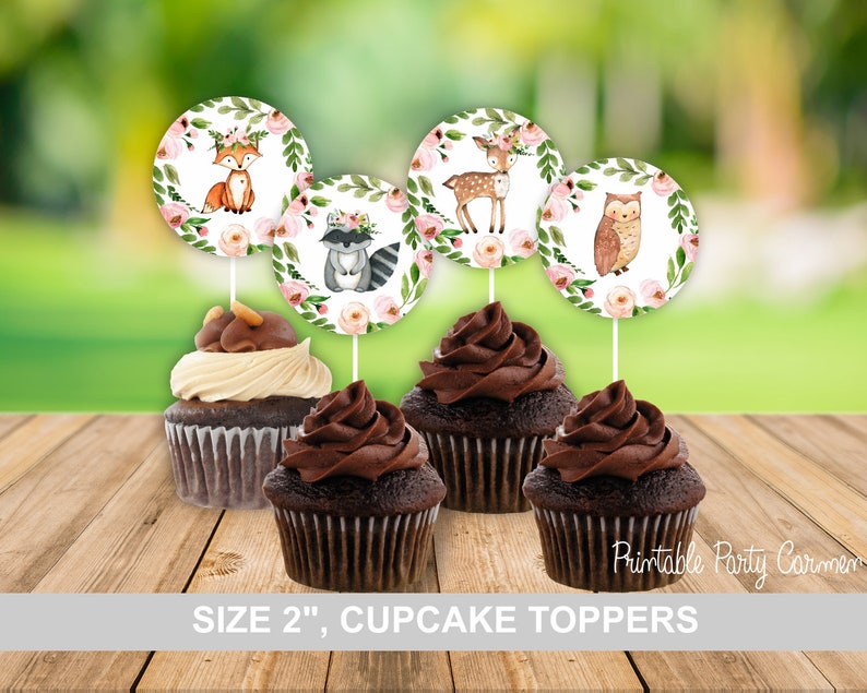 May include: Set of five 2-inch round cupcake toppers featuring woodland animals. The toppers are printed with a watercolor design of a fox, deer, raccoon, owl, and floral accents.  The toppers are perfect for a woodland-themed party.