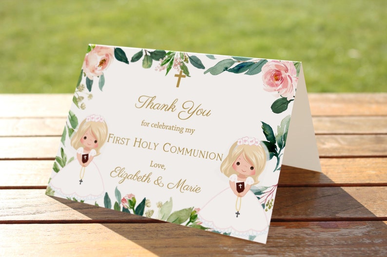 May include: Thank you card with a floral design and two illustrations of girls in white dresses. The text reads "Thank You for celebrating my First Holy Communion. Love, Elizabeth & Marie."