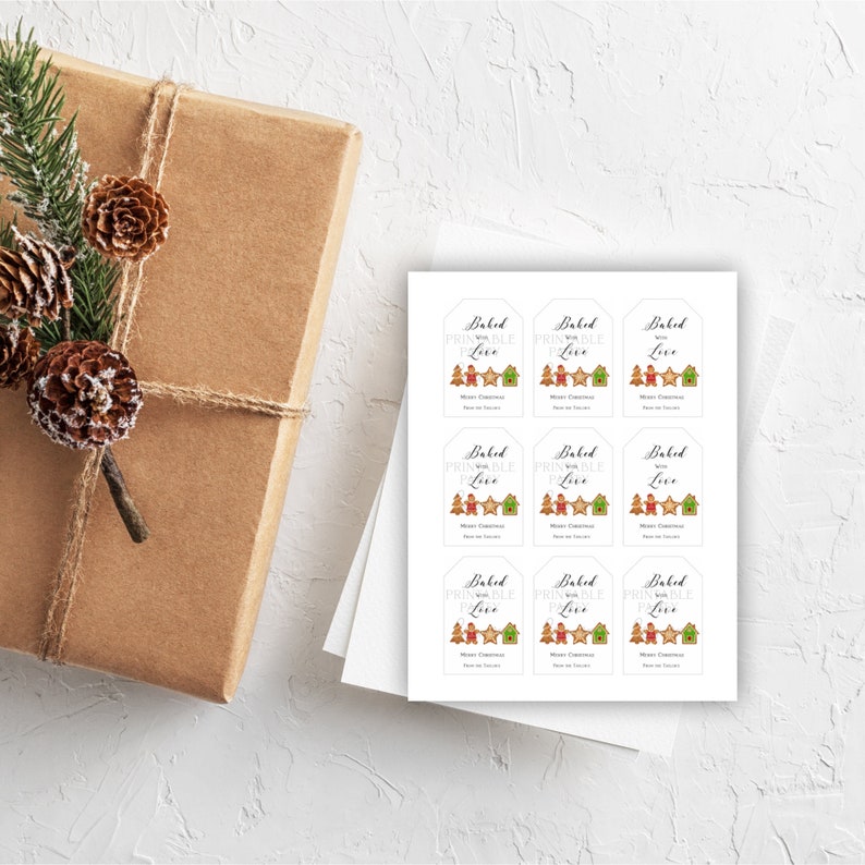 May include: Nine printable gift tags with a gingerbread house and gingerbread people design. The tags are white with brown text that reads "Baked with Printable Love".