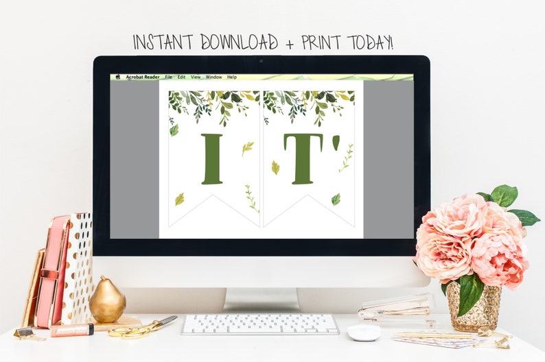 May include: A computer screen displaying a printable banner with the text "IT'" in green letters with a leafy green border. The banner is on a white background. The text "INSTANT DOWNLOAD + PRINT TODAY!" is displayed above the screen.