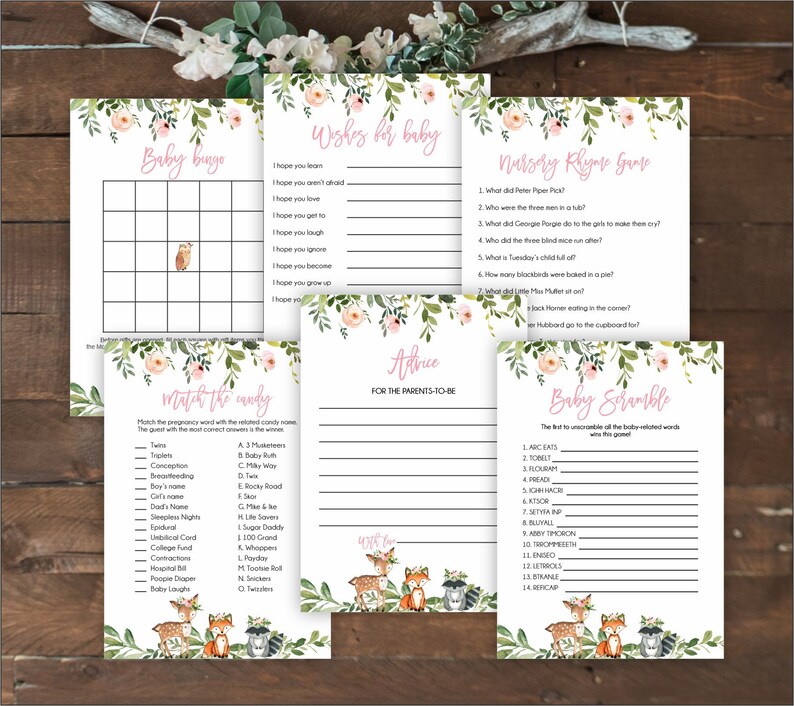 May include: A set of printable baby shower games with a woodland theme. The games include Baby Bingo, Wishes for Baby, Nursery Rhyme Game, Match the Candy, Advice for the Parents-to-Be, and Baby Scramble. The games feature a pink and green color scheme with floral accents and illustrations of deer, foxes, and raccoons.