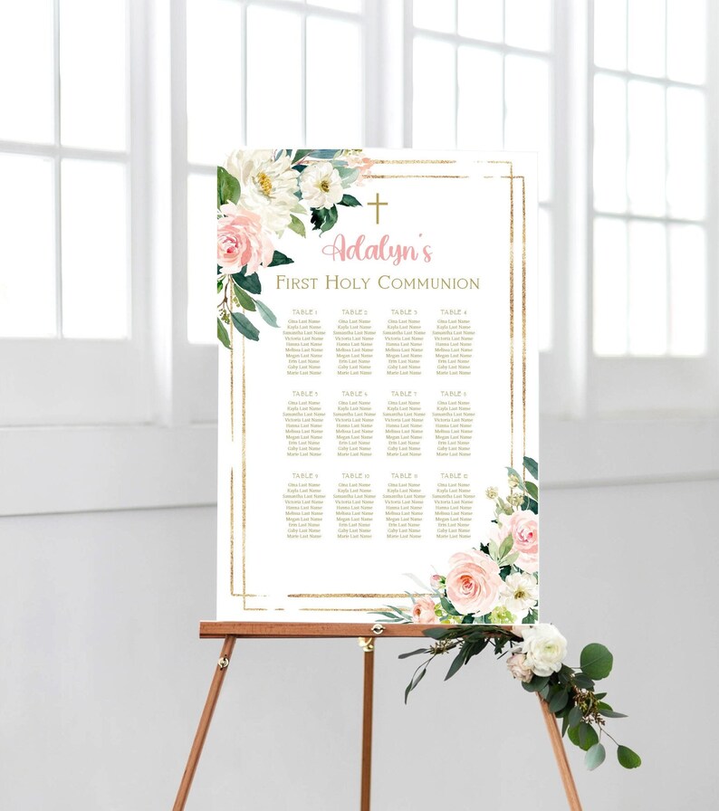 May include: A white and gold seating chart with a floral design. The chart is titled "Adalyn's First Holy Communion" and lists the names of guests at each table.