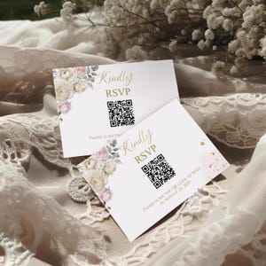 May include: Two white RSVP cards with floral designs and gold text. The cards display a QR code and the words "Kindly RSVP." One card includes the text "Please scan the QR code to RSVP by August 22, 2025."