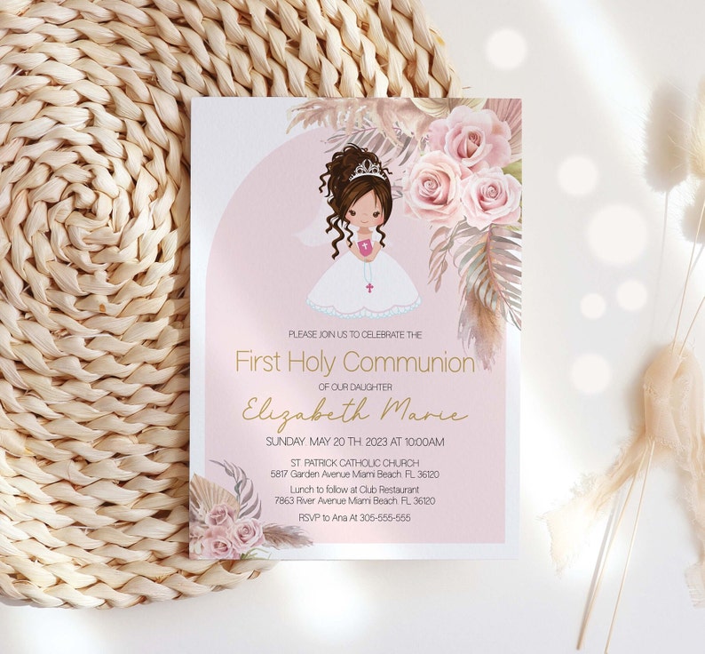 May include: A pink and white invitation card with a watercolor illustration of a girl in a white dress and a crown. The text on the card reads "First Holy Communion of our daughter Elizabeth Marie".