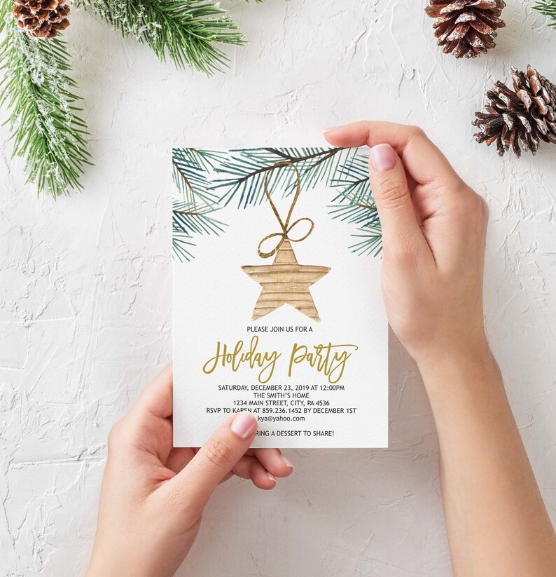 May include: A white invitation card with a gold glitter font. The card features a watercolor illustration of a pine branch with a gold star ornament hanging from it. The text on the card reads "Please join us for a Holiday Party" and includes the date, time, location, and RSVP information.