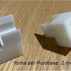 May include: Two white plastic 3D printed mounts. Items per purchase: 2 mounts.