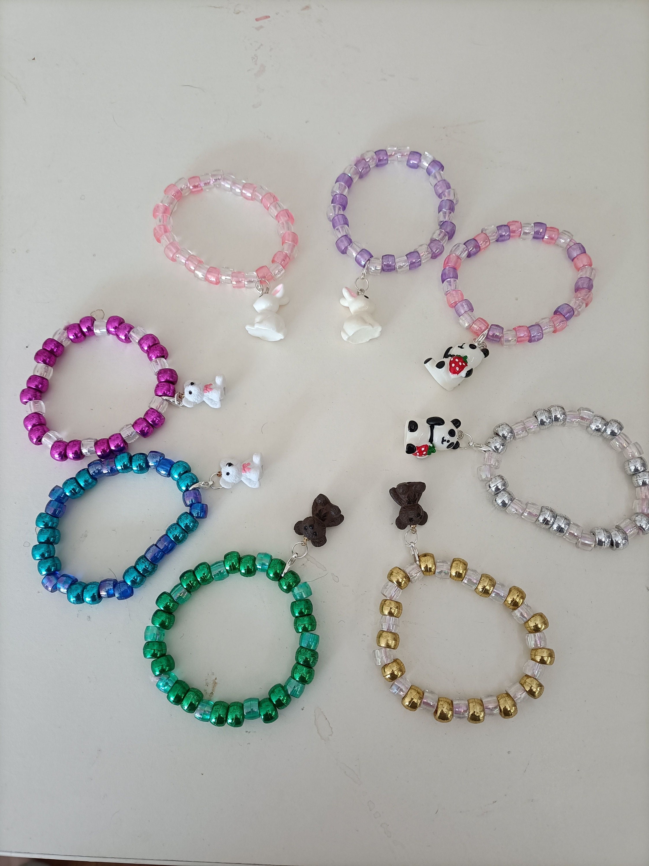 Beaded bracelets with best sale charms