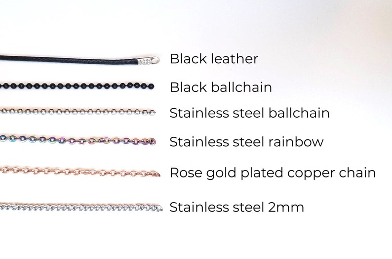 May include: A comparison of different types of chains, including black leather, black ball chain, stainless steel ball chain, stainless steel rainbow chain, rose gold plated copper chain, and stainless steel 2mm chain.