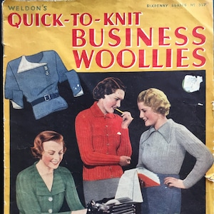 May include: A vintage book cover with a yellow background and red text that reads "Quick-to-Knit Business Woolies". The cover features a photo of three women wearing knitted jumpers and a photo of a knitted jumper.