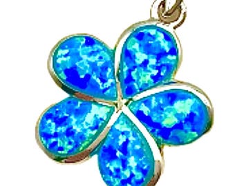May include: A silver pendant in the shape of a flower with five petals. Each petal is filled with a vibrant blue opal-like material, contrasting with the silver setting. The pendant has a loop for a chain, suitable for necklaces.
