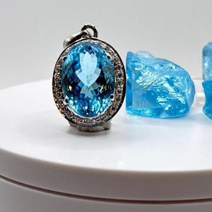 Swiss Blue Topaz Oval Pendant with White Zircon Halo - 17.46 Grams