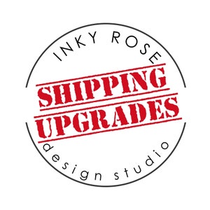 May include: A black and white circle with the text "INKY ROSE SHIPPING UPGRADES design studio" in white. The words "SHIPPING UPGRADES" are in red and appear to be a rubber stamp.