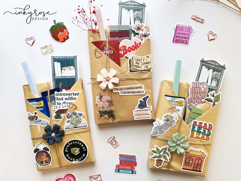 Different colored stickers tucked into yellow wrapping paper covering three different books