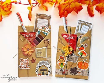 May include: Two brown paper packages wrapped with twine and decorated with fall-themed stickers, including a fox, a scarecrow, a pumpkin, and a bookshelf. The packages also include tea bags, a pen, and a book-themed sticker that says "Read good books".