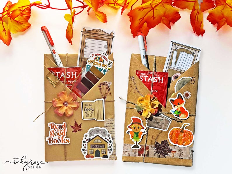 A fall-themed Blind Date with a Book bundle wrapped in kraft paper and twine, decorated with autumn stickers like a pumpkin and books, and includes a highlighter, tea, book tabs, and a bookmark, adorned with a flower, giving off cozy fall vibes.