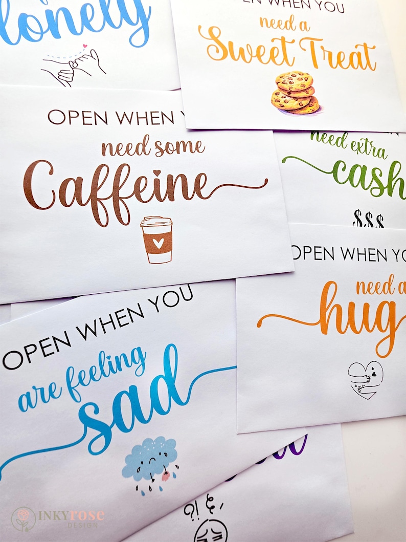 May include: A collection of white envelopes featuring colorful text and illustrations. Phrases include Open When You Need A Sweet Treat, Open When You Need Some Caffeine, Open When You Are Feeling Sad, and Open When You Need A Hug, with icons like cookies, a coffee cup, a rain cloud, and a heart.