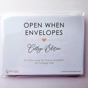 May include: A set of white paper envelopes in a clear plastic sleeve. The front label reads OPEN WHEN ENVELOPES College Edition A Little Love for Every Moment of College Life with a small peach heart and the Inky Rose Design logo and website.