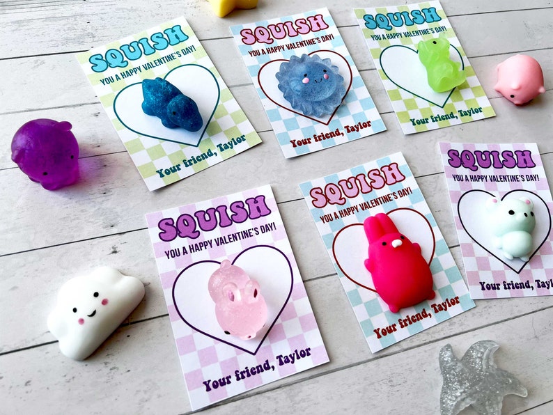 May include: Six Valentine's Day cards with the word "SQUISH" in a retro font. Each card features a different colorful squishy toy and the text "You a Happy Valentine's Day!" with the name "Taylor" at the bottom.