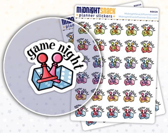 May include: A sheet of colourful planner stickers featuring a game night theme. The stickers feature dice, game pieces, and the text "game night".