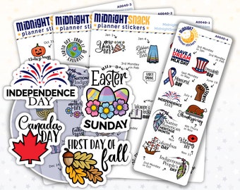 May include: A set of colorful planner stickers featuring various holidays and events throughout the year. The stickers include illustrations of fireworks, a maple leaf, an Easter egg, a turkey, and a feather. The text on the stickers includes "Independence Day", "Canada Day", "Easter", "Thanksgiving", and "Native American Heritage Month".