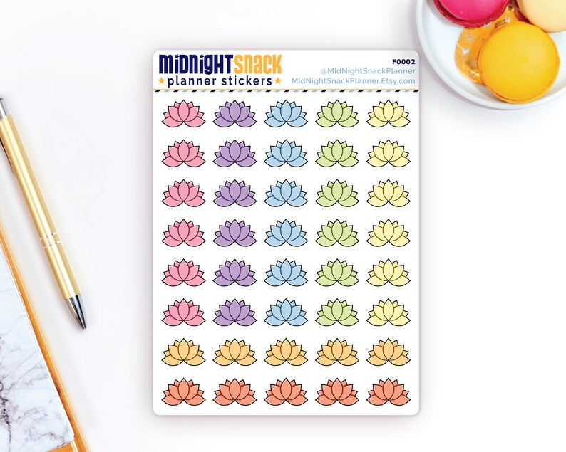 May include: A sheet of planner stickers featuring 24 lotus flower designs in various pastel colours, including pink, purple, blue, green, and yellow. The stickers are arranged in rows of three, with each row featuring a different colour scheme. The text "MIDNIGHT SNACK planner stickers" is at the top of the sheet, along with the social media handle "@MidnightSnackPlanner" and the website "MidnightSnackPlanner.Etsy.com".