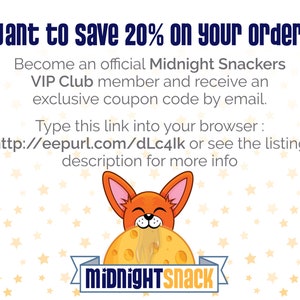 May include: A cartoon fox with orange fur and large ears is biting into a large yellow moon-shaped cookie with the text "MidnightSnack" on it. The background is white with yellow stars.