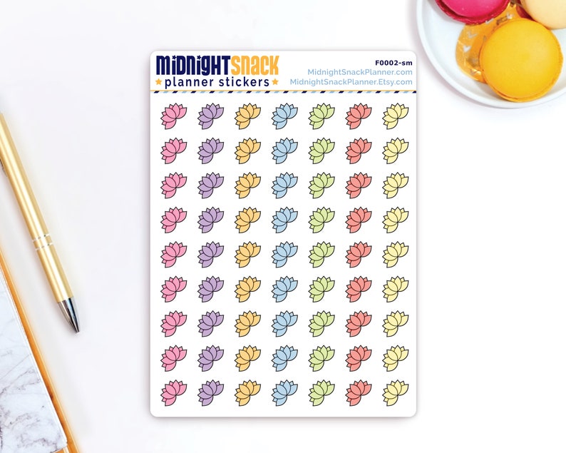 May include: A sheet of planner stickers featuring 36 pastel coloured lotus flower designs. The stickers are arranged in rows of four, with each row featuring a different colour. The colours are pink, purple, yellow, blue, green, and orange. The sheet is white with the text "MIDNIGHT SNACK planner stickers" at the top and "F0002-sm MidnightSnackPlanner.com MidnightSnackPlanner.Etsy.com" at the bottom.