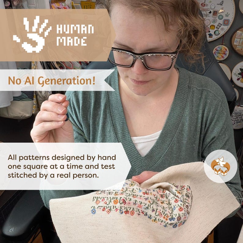 May include: A person wearing glasses is shown working on a cross-stitch project. The image includes the text "HUMAN MADE" and "No AI Generation!" The cross-stitch design features a floral pattern. The text also states that the patterns are designed by hand and stitched by a real person.