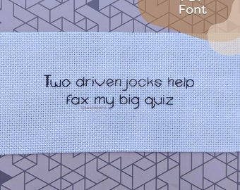 May include: A white fabric with the text "Two driven jocks help fax my big quiz" in black.