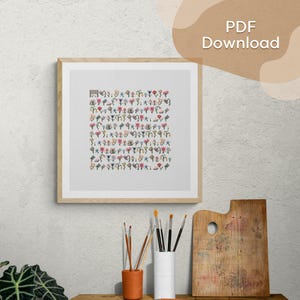 May include: A framed cross-stitch art piece with a beige wooden frame. The artwork features a grid of colorful, pixelated floral and geometric patterns. The text "PDF Download" is visible in the upper right corner.