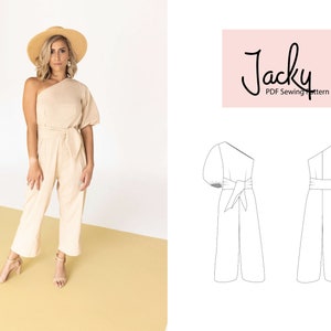 May include: A beige one-shoulder jumpsuit with a tie waist and puff sleeves. The model is wearing a straw hat and heels. The image also includes a line drawing of the jumpsuit in two views.