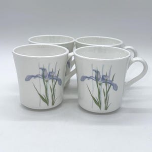 May include: A handmade wooden sign with the text "Welcome" in a playful font. The sign is painted white with a distressed finish, and features a small, decorative heart. Dimensions are approximately 12 inches wide and 6 inches tall.