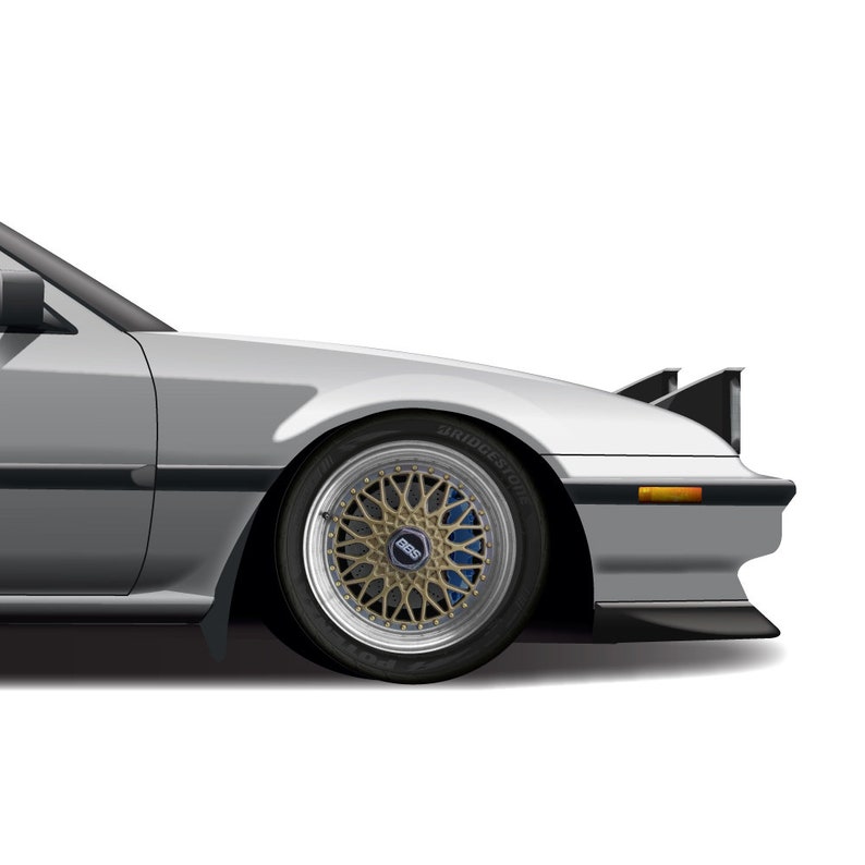 May include: A silver car with a black spoiler and a gold and blue wheel with the word "BRIDGESTONE" on the tire.