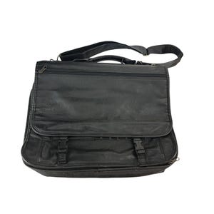 May include: A black leather briefcase with a zippered closure, two adjustable straps, and a shoulder strap.