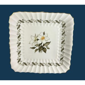 May include: A set of three ceramic mugs with a speckled, matte finish. The mugs are in shades of cream, light gray, and dark gray. Each mug has a simple, minimalist design, perfect for coffee or tea.