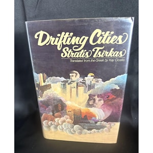 May include: A book cover with a dark background and a colorful illustration of a city with a yellow dome. The title of the book is "Drifting Cities" by Stratis Tsirkas, translated from the Greek by Kay Cicellis.