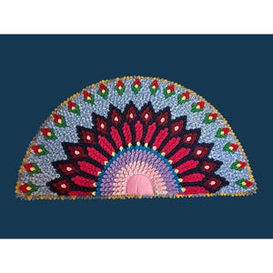 May include: A semi-circular rug featuring a layered, petal-like fabric construction. The design radiates from a solid pink center, transitioning through rows of purple, dark red, and light blue fabric pieces, accented with small red and green floral motifs.
