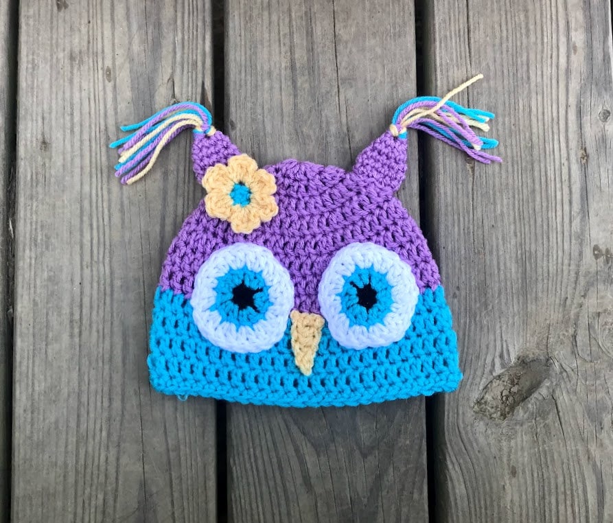Crochet purple and blue owl beanie hat with yellow flower