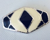 Vintage cloisonné off-white and blue enamel silver tone metal brooch.