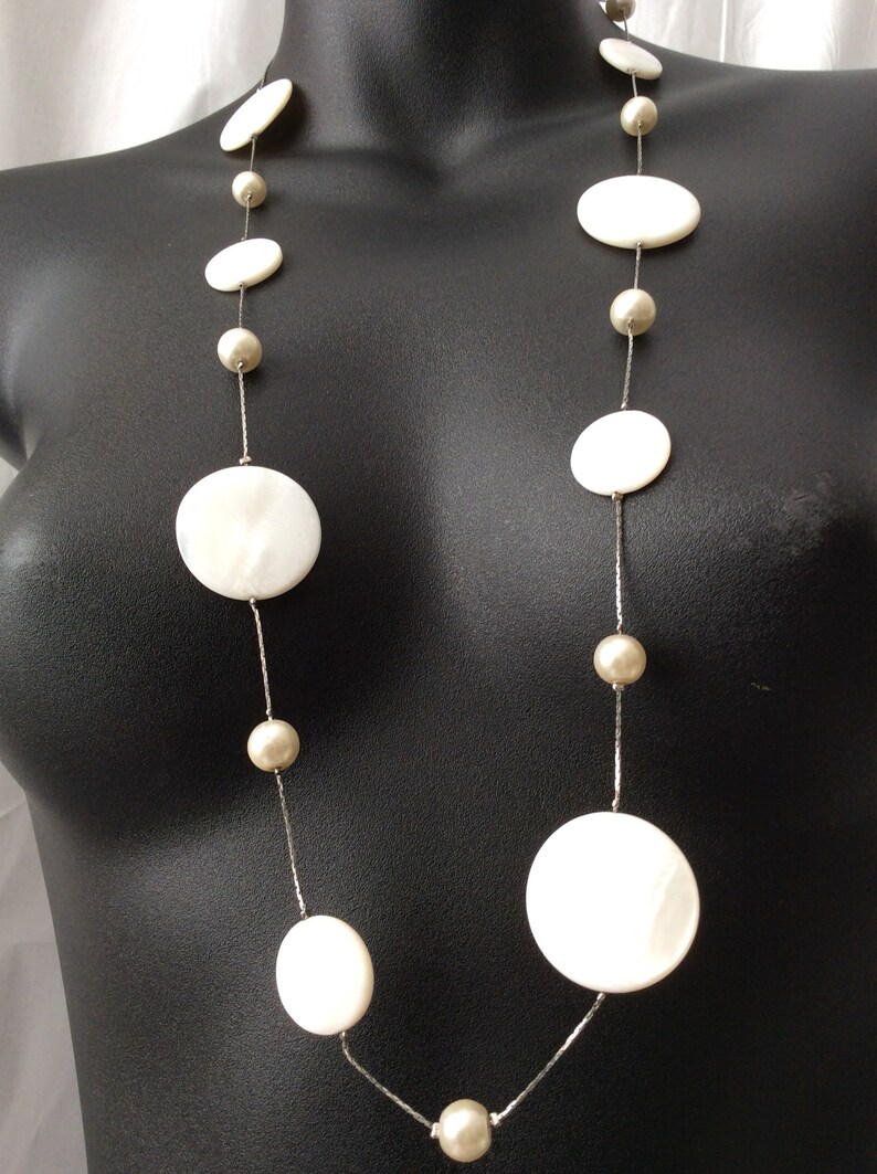 Vintage Long Classy Beautiful Floating White Round mother of pearls and glass beads in a Silver chain necklace.