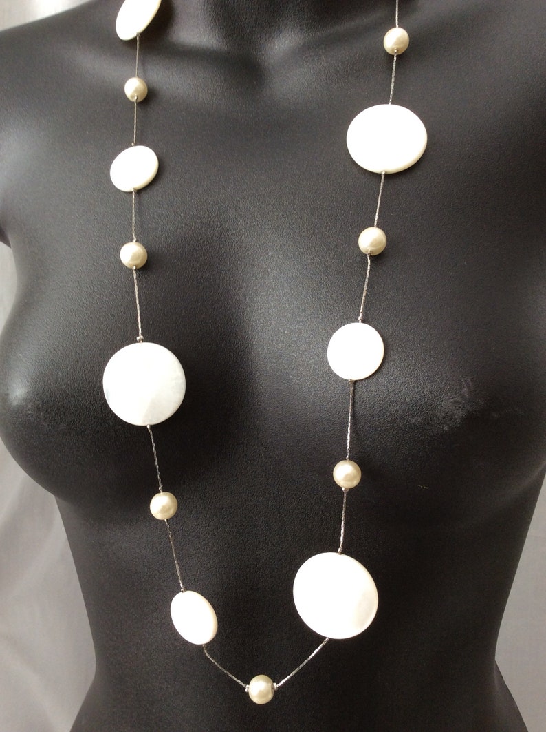 Vintage Long Classy Beautiful Floating White Round mother of pearls and glass beads in a Silver chain necklace.