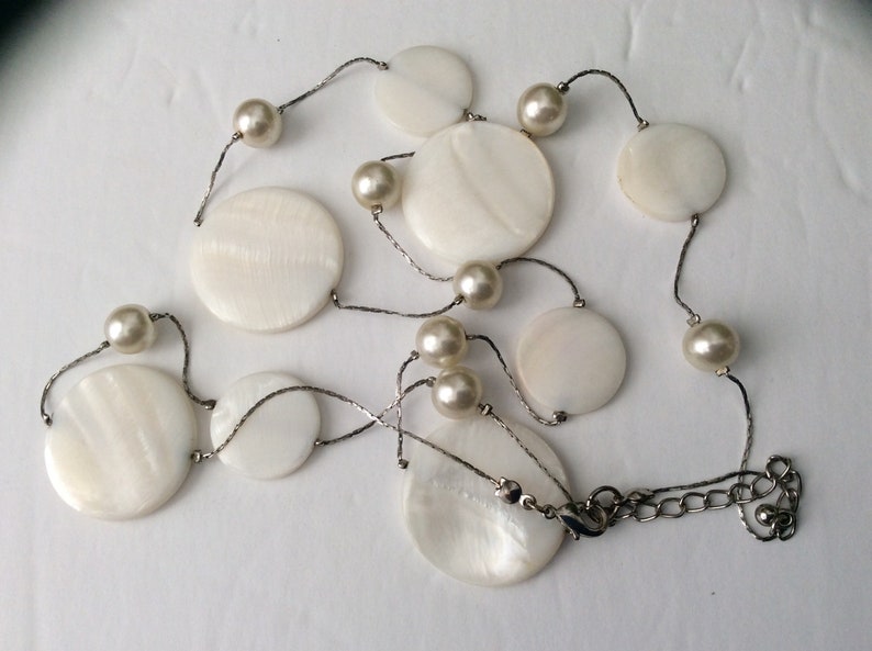 Vintage Long Classy Beautiful Floating White Round mother of pearls and glass beads in a Silver chain necklace.