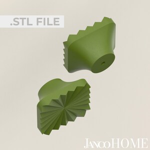 May include: Two green, geometrically shaped, 3D printed knobs. The knobs have a starburst design and a smooth, rounded top.