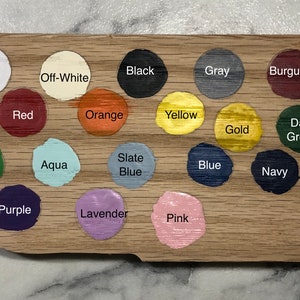 May include: A color chart with 18 paint swatches, showing a variety of colors including white, black, gray, red, orange, yellow, green, blue, purple, pink, aqua, lavender, slate blue, gold, burgundy, dark green, and navy.